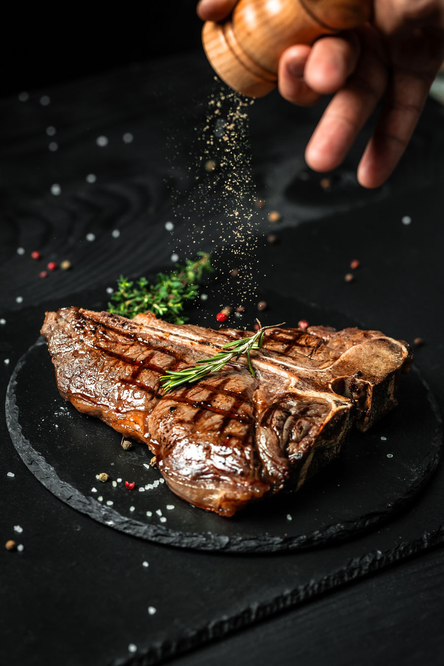 Chef's-Exclusive-T-bone Che'fs Exclusive Two-raw-steaks-seasoned